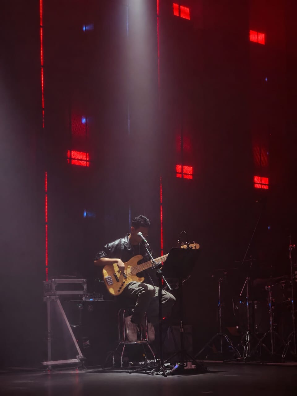 Chong Vision performing bass on stage